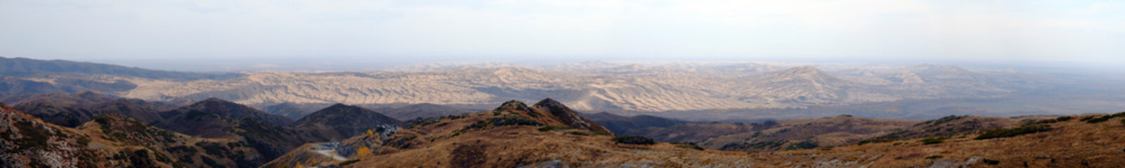 Fototapeta premium Panorama of beautiful nature landscape with gravel road and sand dunes.