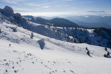 Fototapeta na wymiar Big mountain skiing, or backcountry skiing, in Ciucas Mountains, Romania