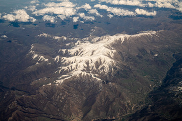 Top View from plane to snow capped peaks of Caucasus Mountains