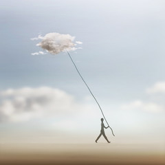 surreal man successfully catches a cloud from the sky