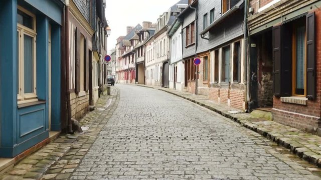 HONFLEUR, FRANCE - APRIL 08, 2018: view of empty beautiful street with old traditional houses at the center of Honfleur, Normandy, France