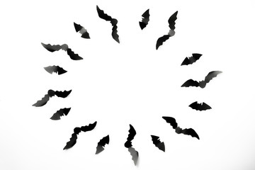 Halloween paper decorations concept. Black paper bats on a white background. Halloween concept.