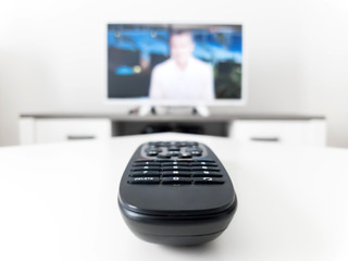 TV with white screen on a stand in the room.