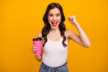 Go Photo of funny pretty lady hold pink paper takeout coffee cup raise fist supporting sports team...