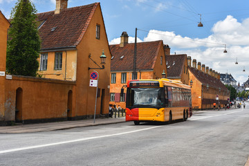 Copenhagen ground public transport line and yellow ancient houses of Nyboder area