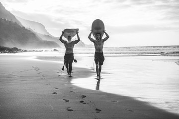 Multigeneration friends going to surf on tropical beach - Family people having fun doing extreme...