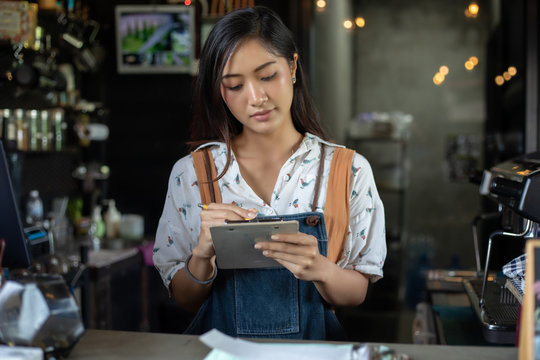 Asian Women Barista Smiling And Using Coffee Machine In Coffee Shop Counter - Working Woman Small Business Owner Food And Drink Cafe Concept