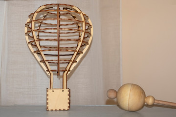 Wooden aerostat constructor and wooden rattle. Wooden toys.
