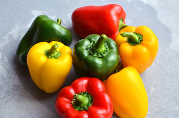 Multi-colored fresh bell peppers. Green, red and yellow vegetables. Organic healthy food concept.