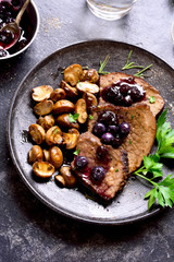 Beef with mushrooms and blueberry sauce