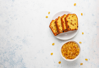 Traditional raisin cake slices with raisin on light background,top view