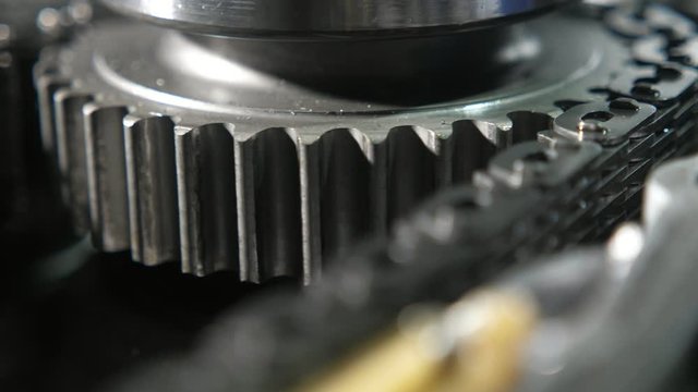 Spherical cogwheel revolting fast using metallic chain in modern car transmission