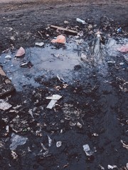  Puddle with quarrel on the street. Environmental pollution