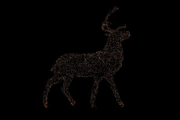 Shining christmas deer silhouette from yellow xmas lights outdoor in night darkness.
