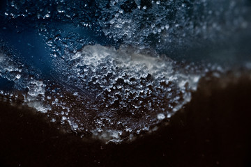 Traces of candied honey on glass, macro shot.