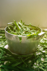 Pan with leaves. Natural background with sunlight.