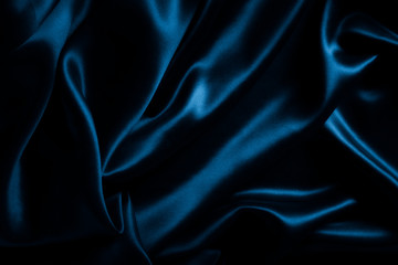 Satin blue silk background, close-up