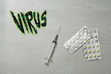 pills and syringe with text virus