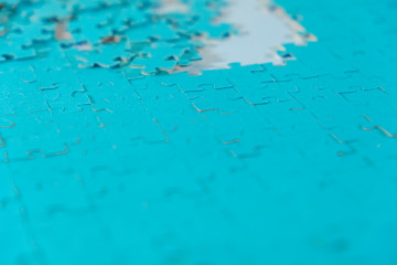 Blue jigsaw puzzle background. Puzzle texture background.