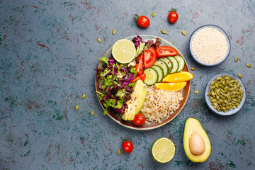 Healthy vegetarian balanced food concept,fresh vegetable salad, buddha bowl on dark background