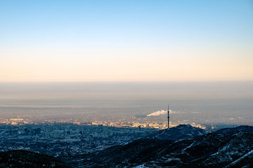Almaty city captured from mountains. Morning in winter Almaty.