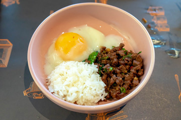 Rice topped with stir-fried beef and basil with fried egg. Thailand tradiotional food. asian crusine.