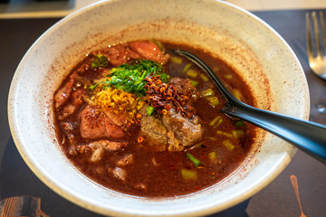 Brown with blood small noodle soup with beef stewed, Thailand tradiotional food.