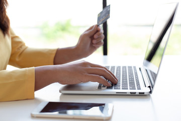 Fototapeta premium Women use laptop register via credit cards to make online purchases, Online shopping or Internet technology concept.
