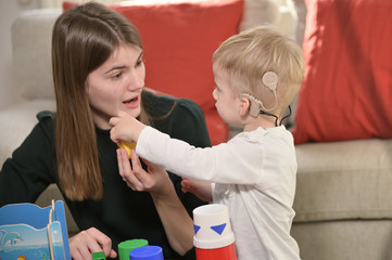 A Boy With Cochlear Implants Playing - 324822070
