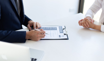 Business people hold resume documents, interviews for the work experience of young men applying as financial accountants for the company, Job interview and Job application..Concept...