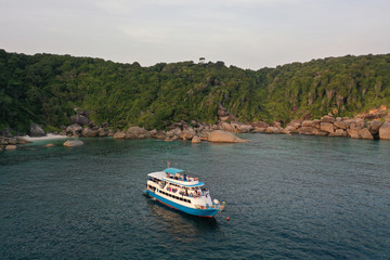 Fototapeta na wymiar Scuba diving liveaboard boat beside tropical island 