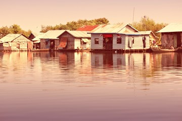 Cambodia floating village. Retro style filtered color.