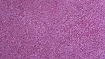 Lilac pink suede leather background with neat texture and copy space, fuzzy leather with a napped...