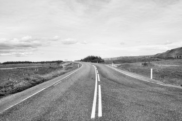 Iceland road. Black and white vintage toned photo.