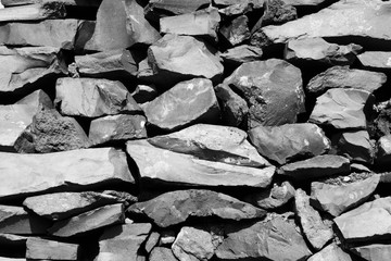 Basalt stone texture. Black and white retro style photo.