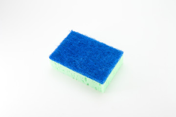 Sponge for washing dishes in light green with a blue abrasive part on a white isolated background. Rectangular foam sponge.