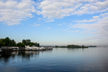 Volga river in Russia. Cloudy summer weather. River port. Ship parking.