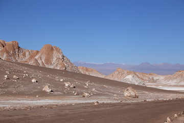 Mountains of Atacama desert in Chile against a clear blue sky.