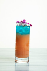 Papaya and blue curaçao liquer cocktail