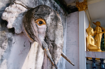 An elephant head statue on a wall in Buddhist temple. Phuket, Thailand