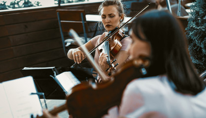 String Orchestra Female Playing Outside The Terrace