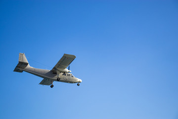 Fototapeta na wymiar Small aiplane above the sea