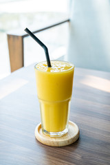 mango smoothie glass in cafe