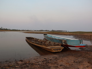 Two boats tied at the bank of the river