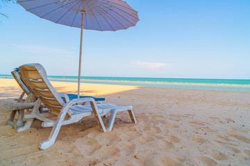 beach chair on sand with ocean sea background