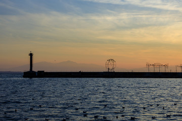 Fototapeta premium lighthouse at sea at sunset