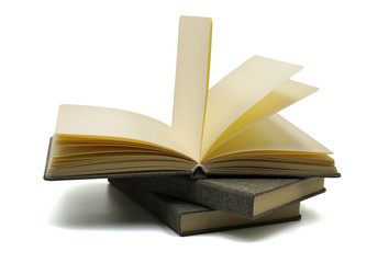 Opening blank notebook on stack of books isolated on white background ,education ,wisdom ,knowledge concept