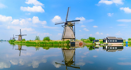 Fototapeta na wymiar Panorama of the windmills and the reflection on water in Kinderdijk, a UNESCO World Heritage site in Rotterdam, Netherlands