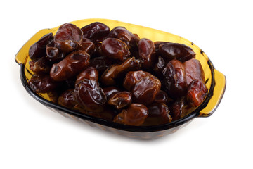 Date fruits on plate isolated on white