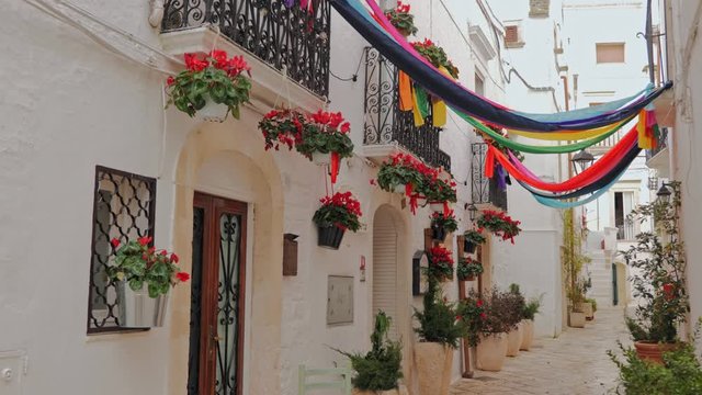 Walking charming white streets of Locorotondo in Puglia, Italy